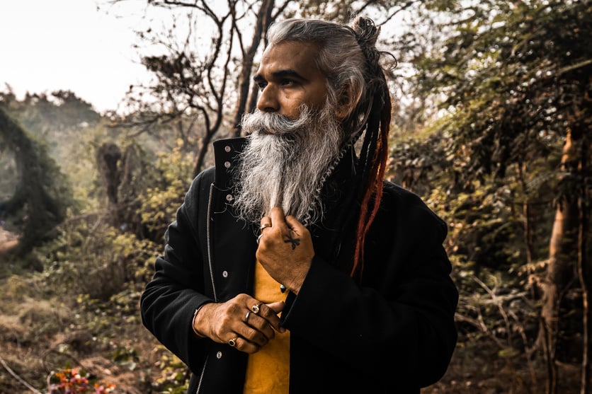 Stylish Man with Grey Hair in the Woods